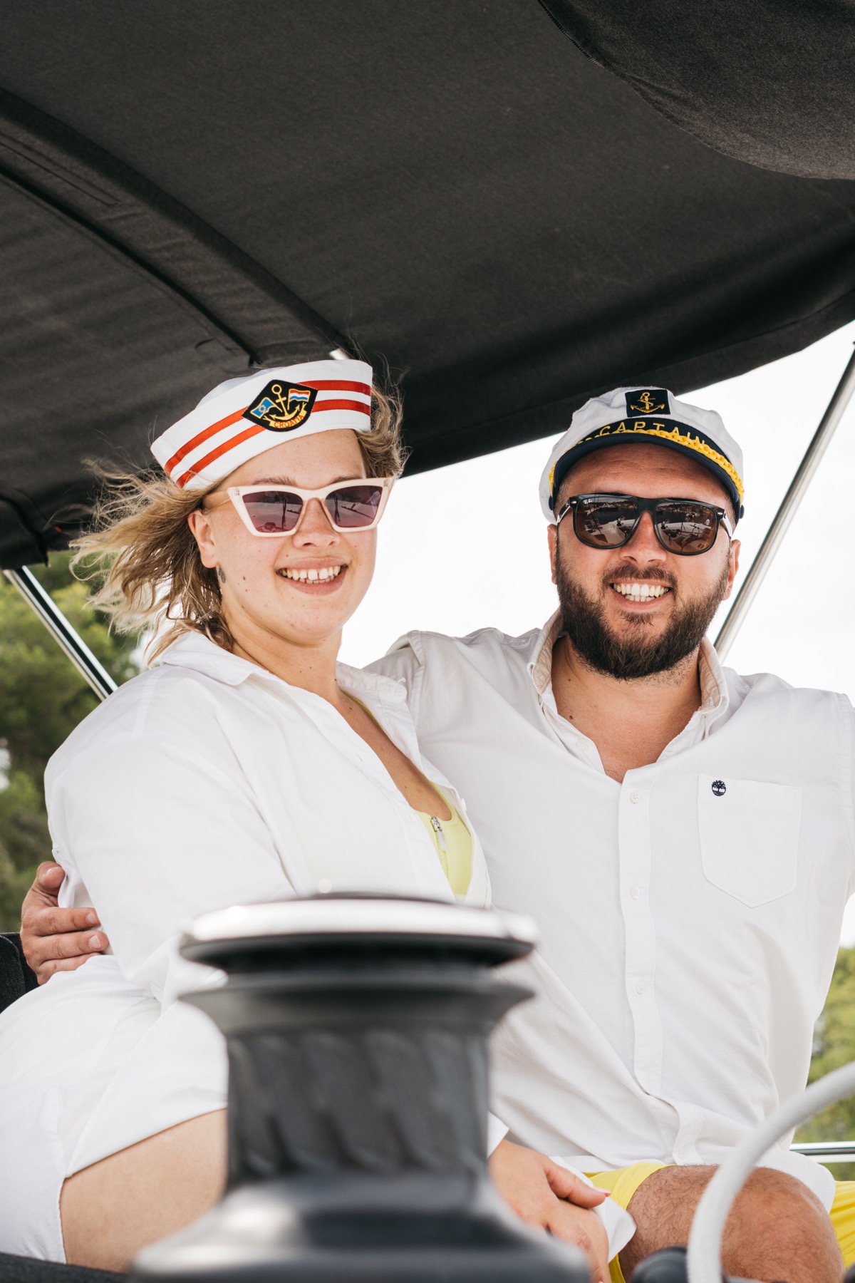 Ana and Roman at the helm under the bimini