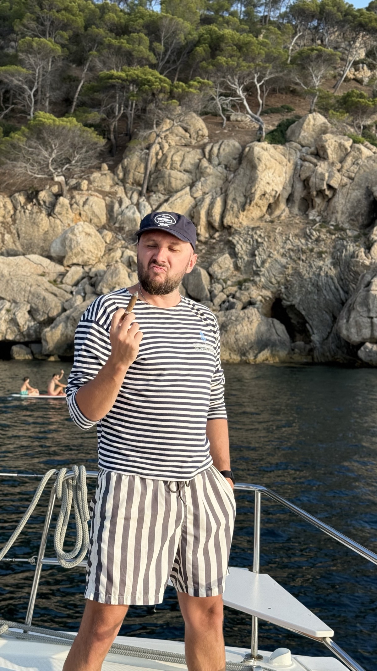 Roman posing playfully on the catamaran bow