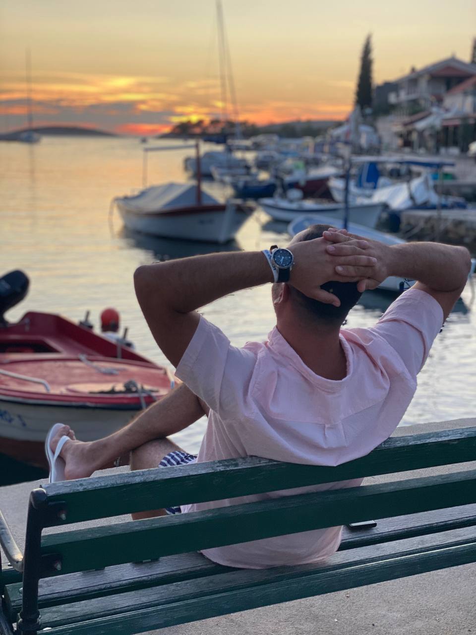 Watching the sunset at a harbour, evening wind-down